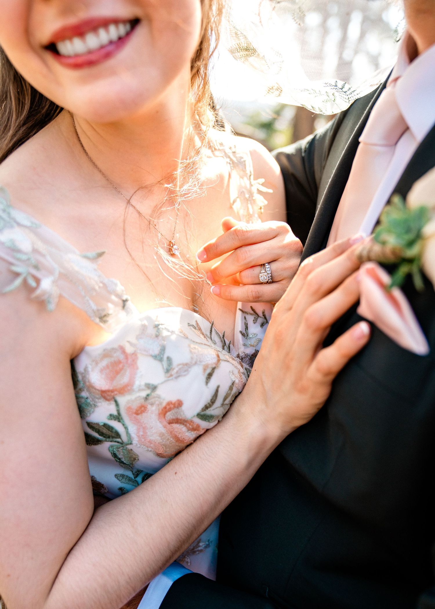 Wedding couple photographed in a series of close-up shots highlighting their floral dress and black suit.