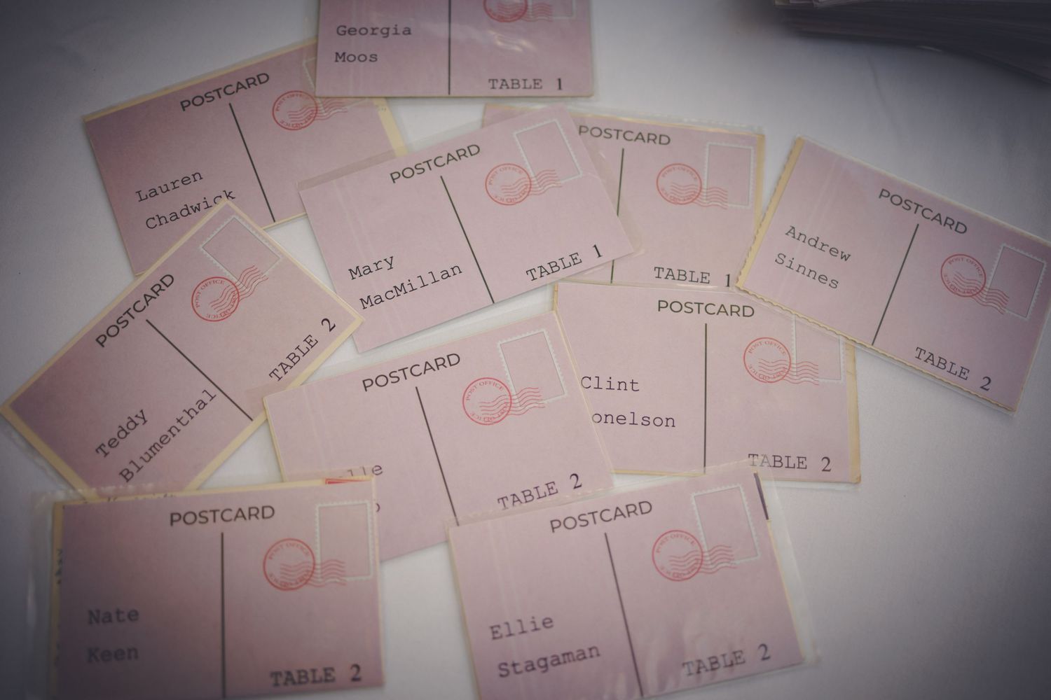 table place cards done up like old postcards.