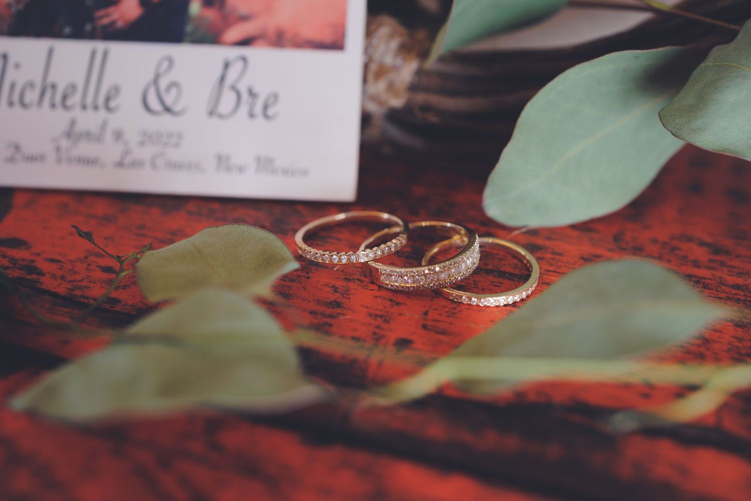 a close up shot of wedding rings on a table