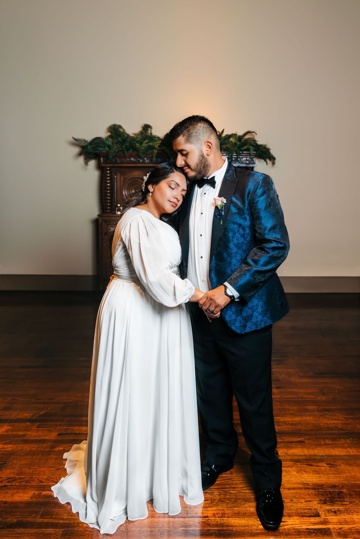 groom and bridge hold each other closely