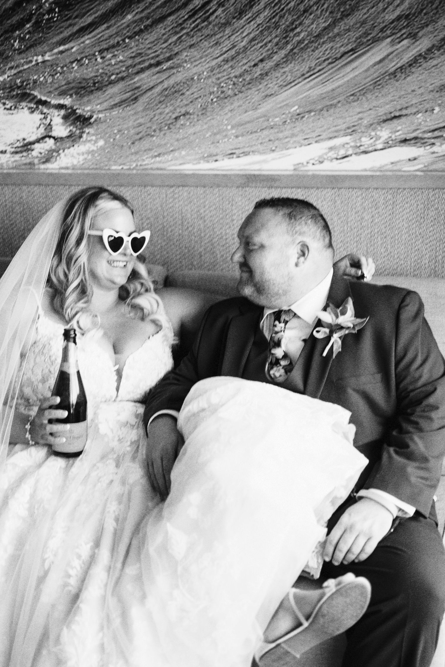 Black and white wedding portraits arranged in a stylish collage format.