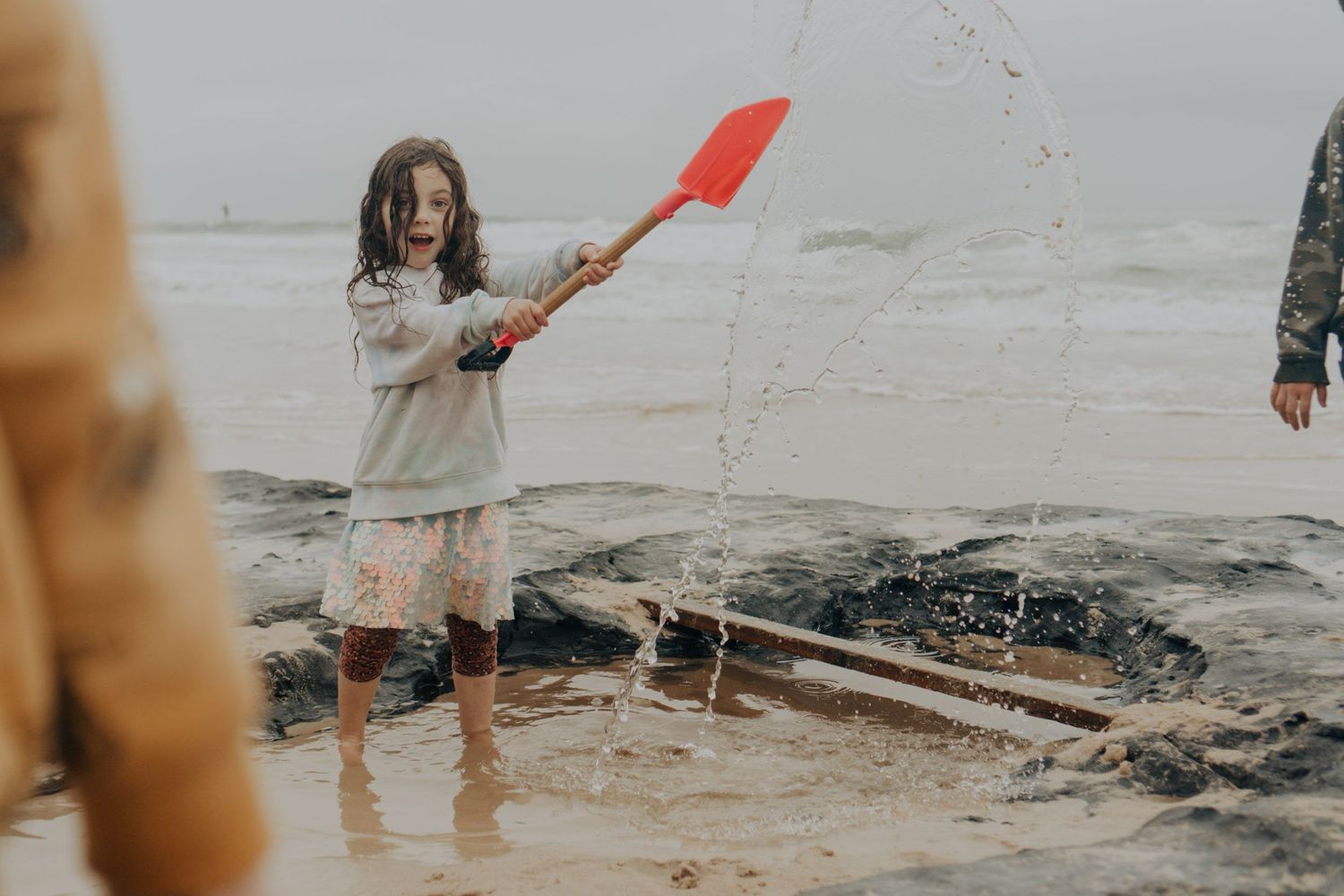 Girl playing on the beach