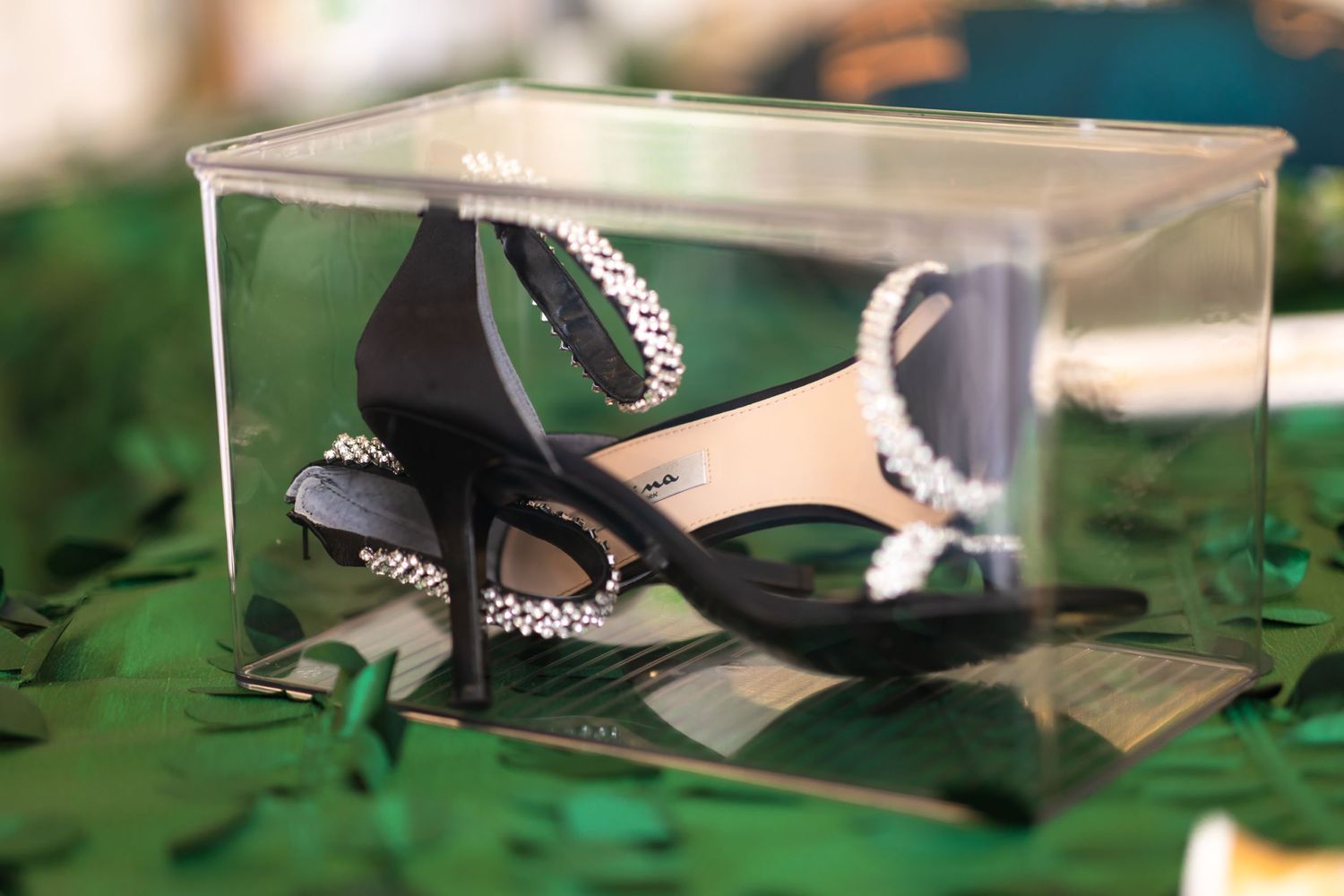 Close-up of formal event decor with green lighting effects.