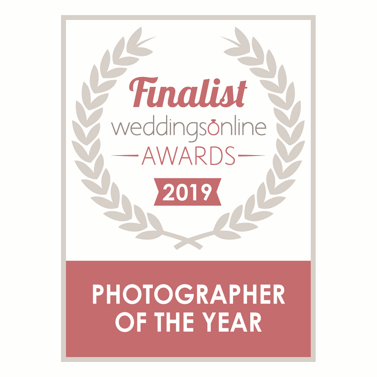 Pink and white Weddings Online Awards 2019 Photographer of the Year finalist badge with laurel wreath.