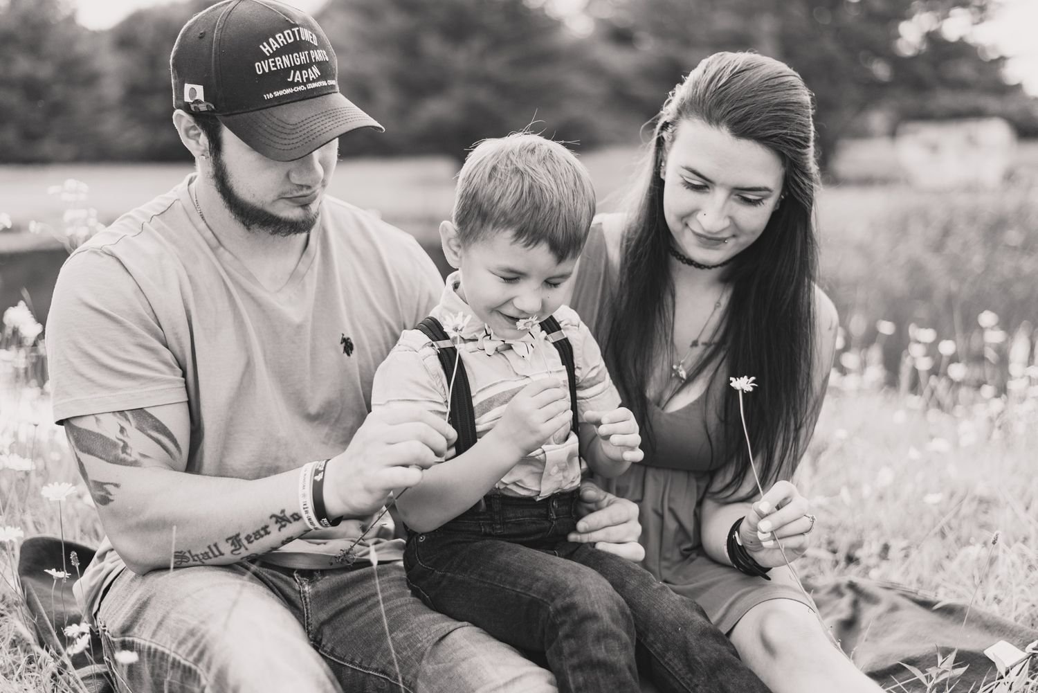 Family smelling flowers in black and white in Clarion Pennsylvania