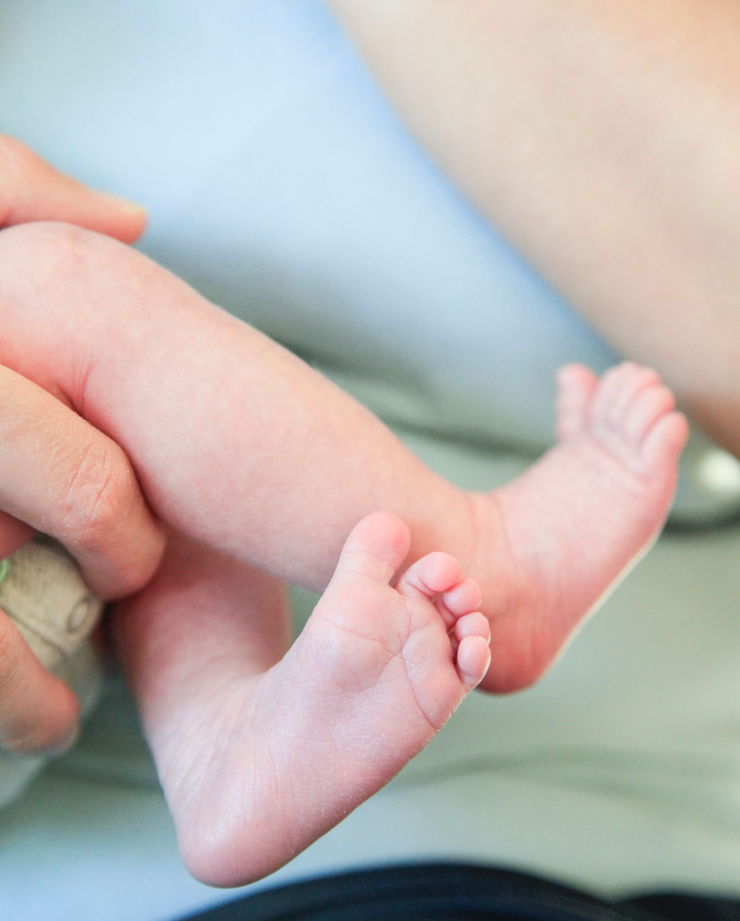Close-up of tiny baby feet with soft focus and gentle natural lighting.