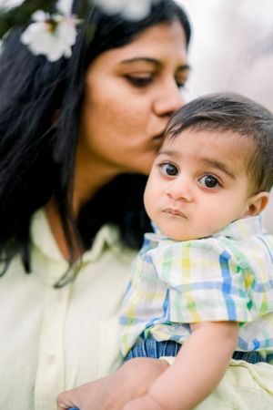 A series of intimate portrait shots showing gentle interaction and connection.