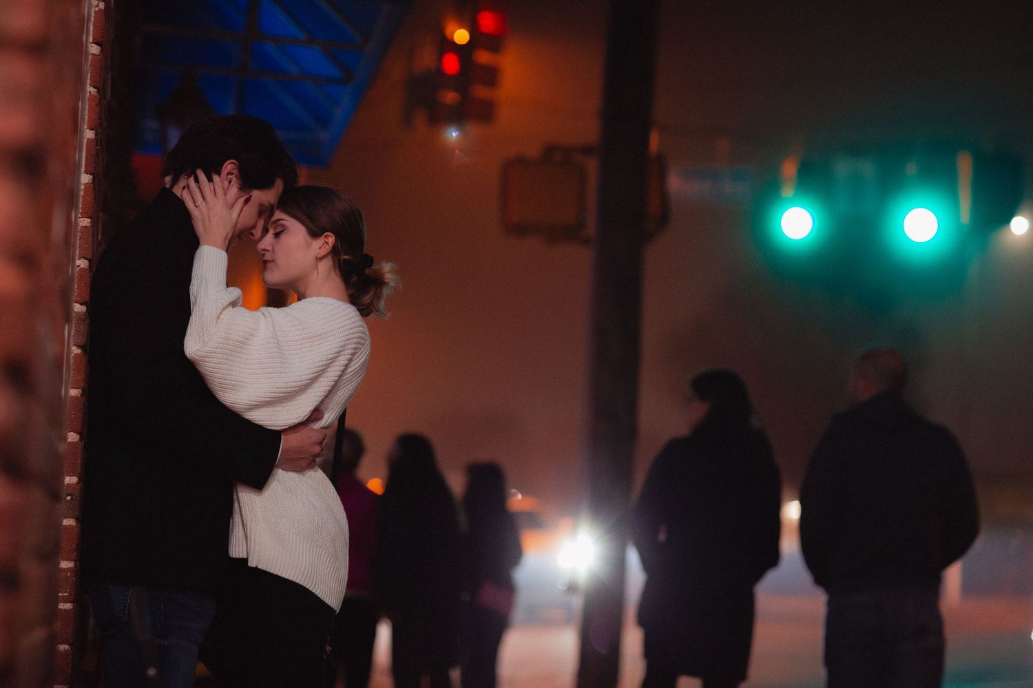 A romantic dance scene with silhouettes visible against blue and red lighting.