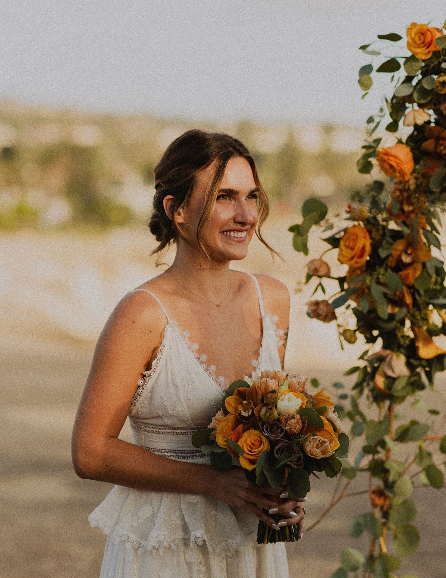 Candid of bride in Palos Verdes cliffs wedding overlooking the ocean