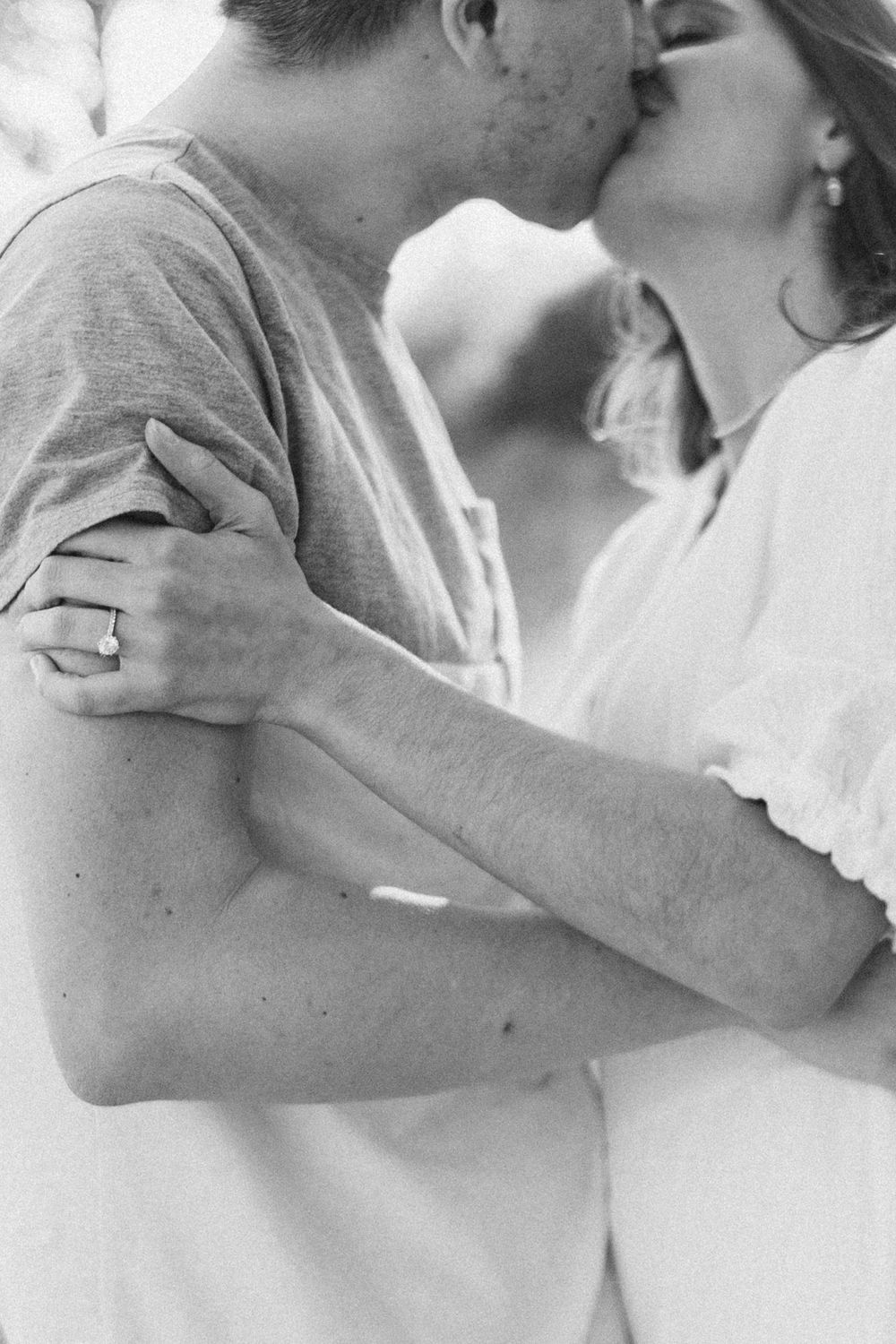 engaged kansas city couple kissing gently