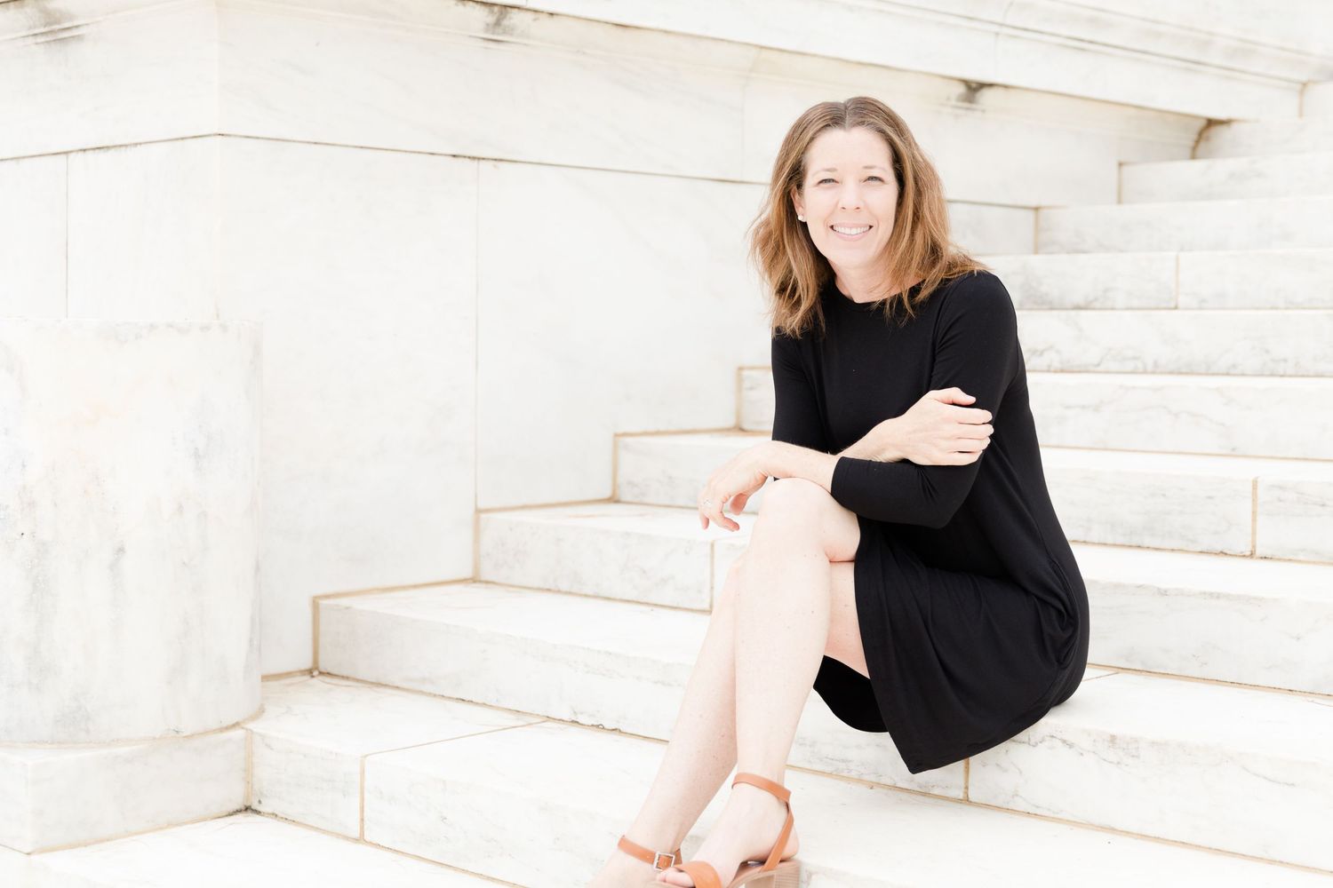 Woman sitting on steps at Jefferson Memorial Washington DC