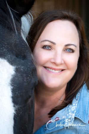 Kristine and Comet taking a business headshot at Crossroads Ranch in Penngrove