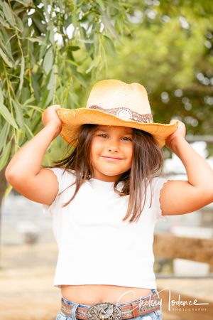 cowgirl holding her western hat in Petaluma, ca