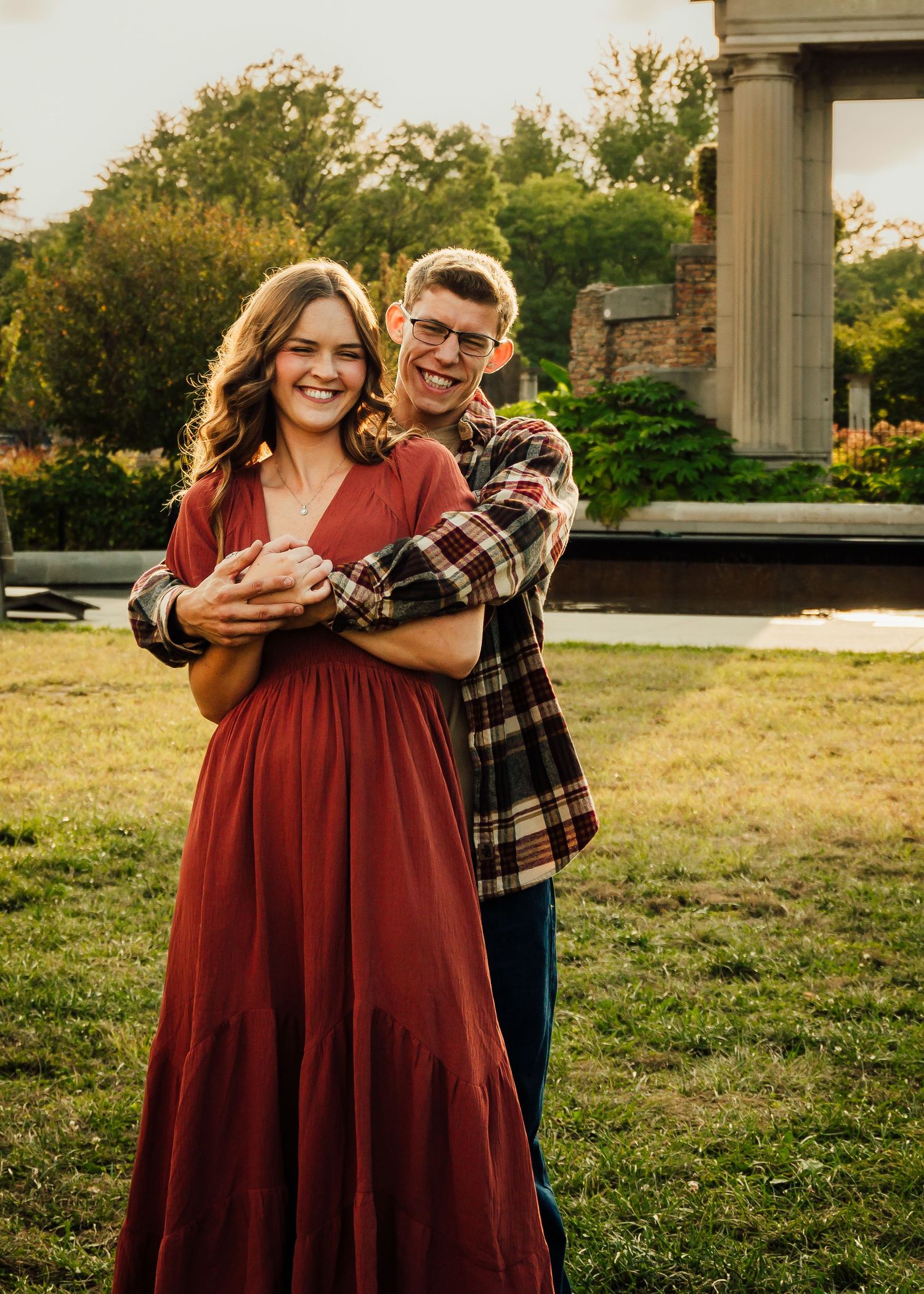 Couple embrace during photoshoot at Holliday Park