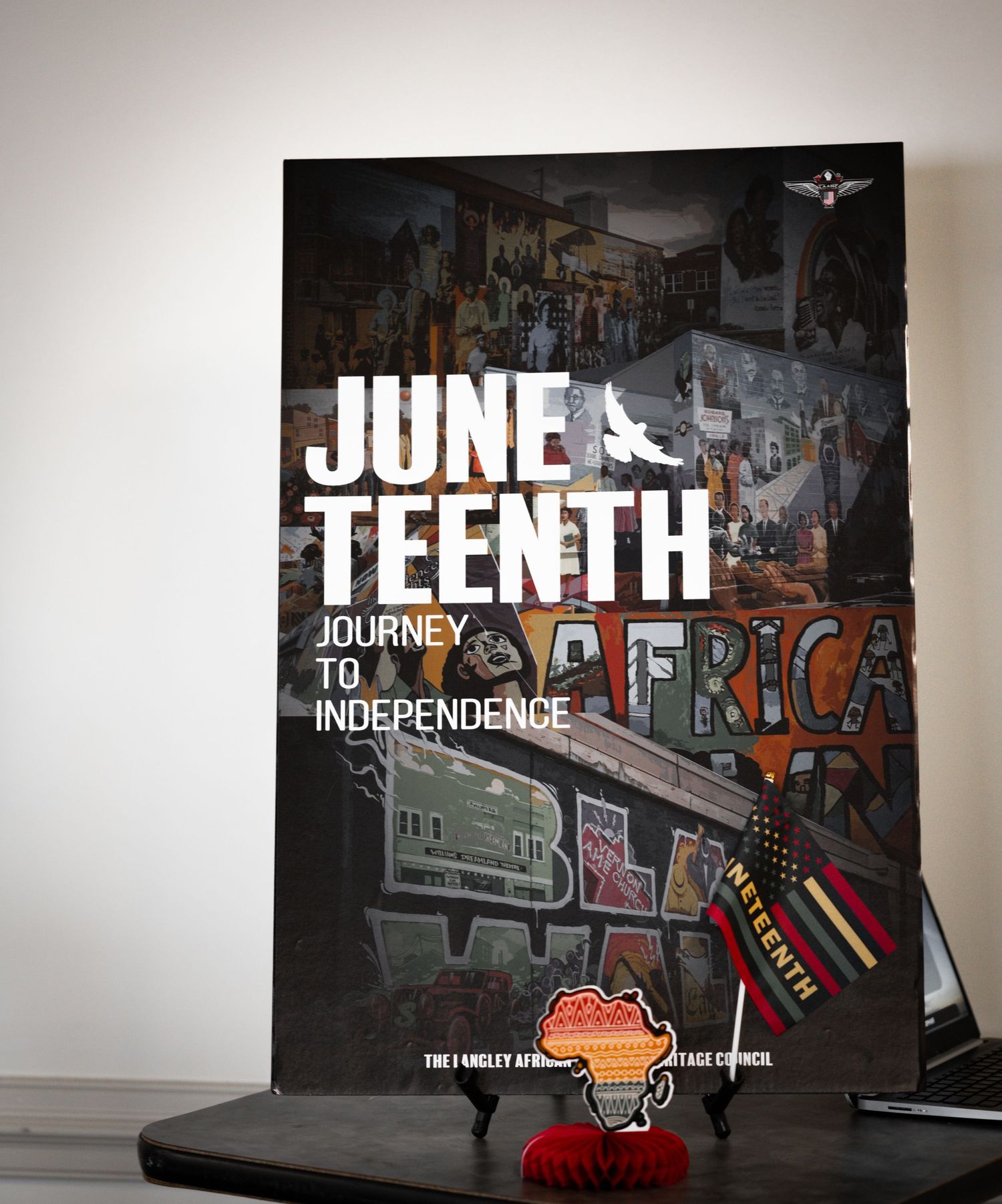 A Juneteenth book cover with Journey to Africa title against a dark background.