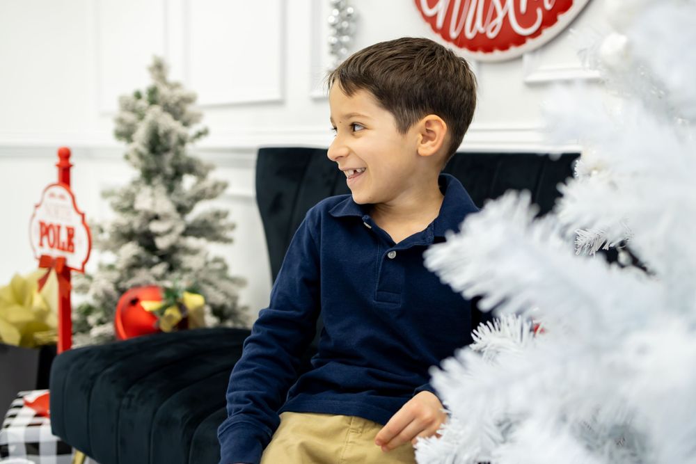 Boy smiling for candid photo holiday