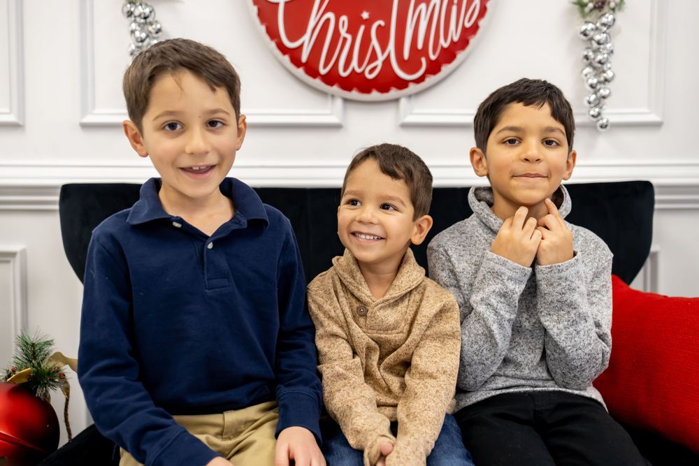 brothers smiling for family christmas session