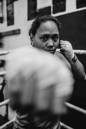 Close-up of boxing stance and defensive position during training.