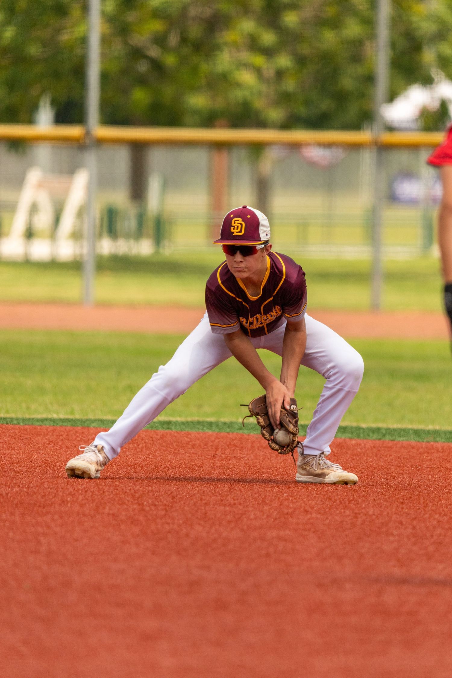 Baseball player fielding a ball