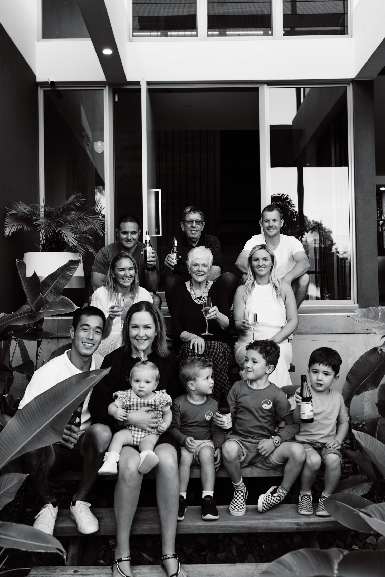 New Zealand family taking a holiday on the Sunshine Coast cheering to celebrating together for the first time