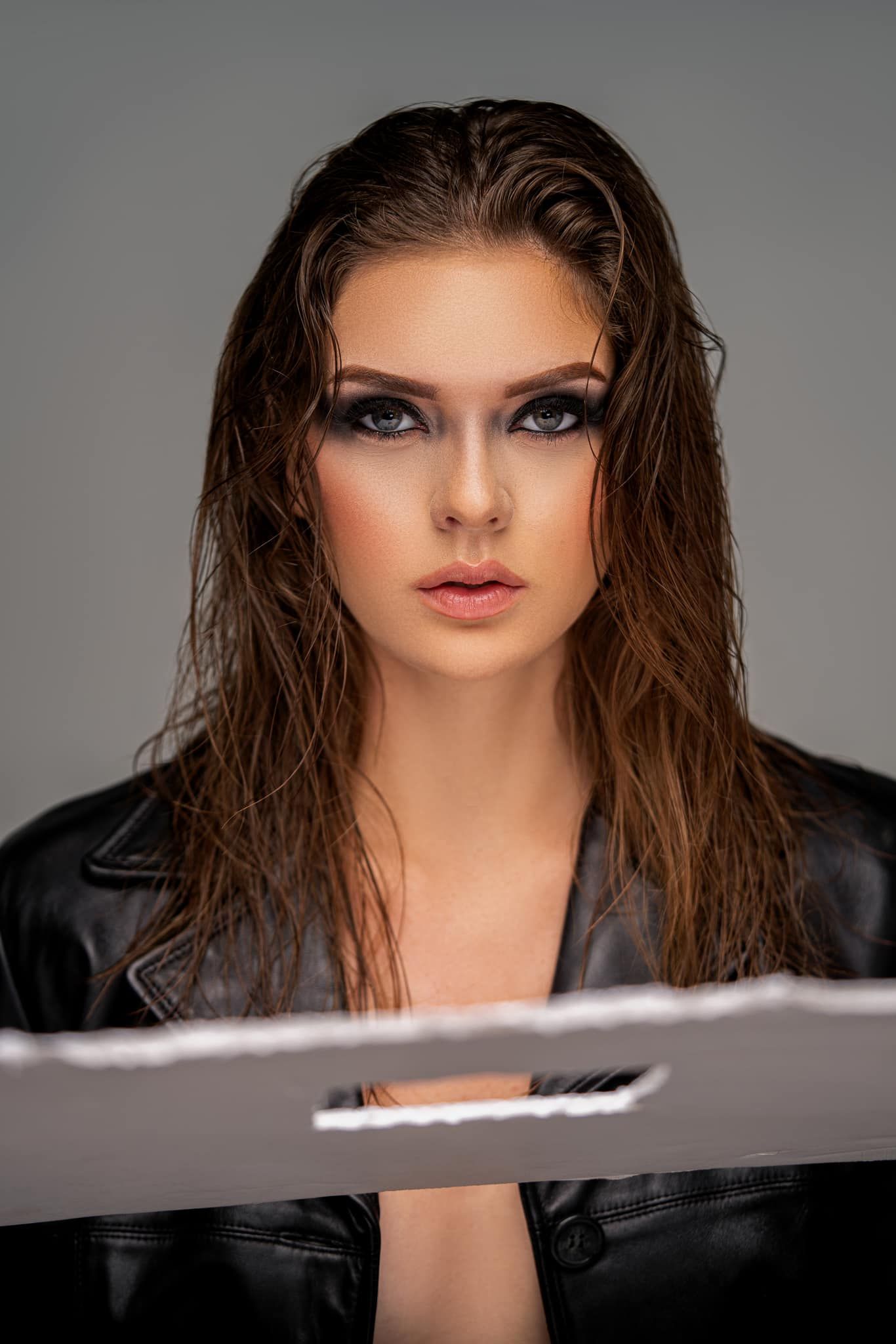 Orlando glamour portrait photographer Ray Alvarez — high fashion editorial portrait with dramatic wet hair and leather jacket styling