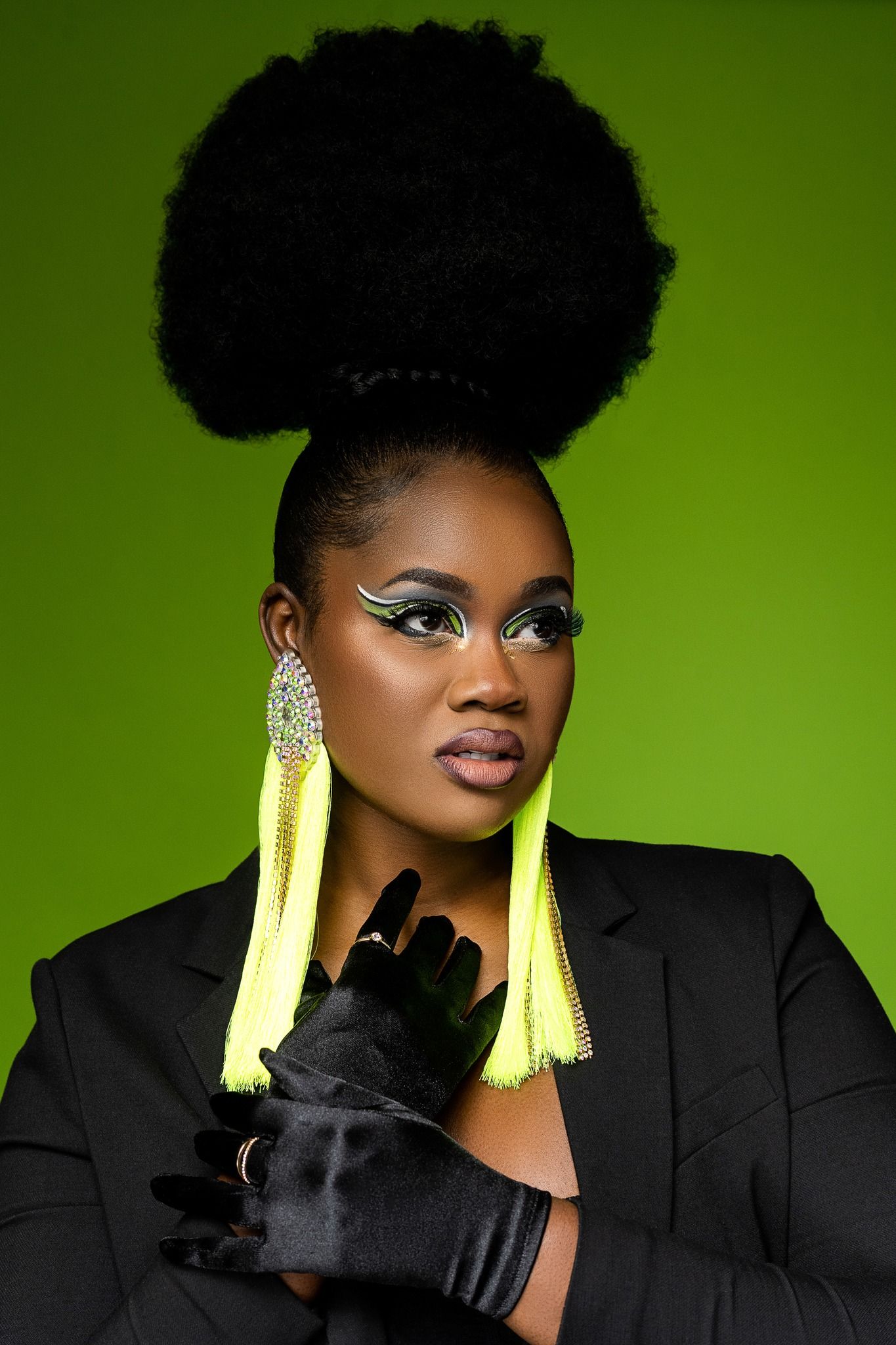 Orlando creative portrait photographer Ray Alvarez — bold editorial portrait with natural afro and vibrant green background