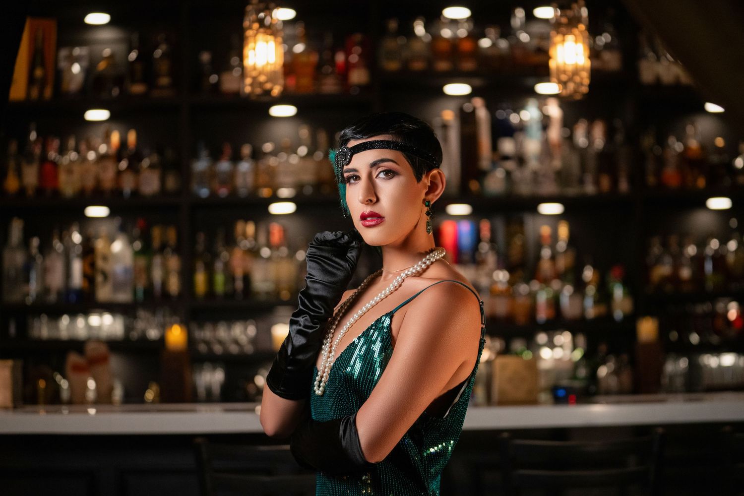 Orlando birthday photoshoot photographer Ray Alvarez — moody editorial portrait session in ambient bar setting with dramatic lighting