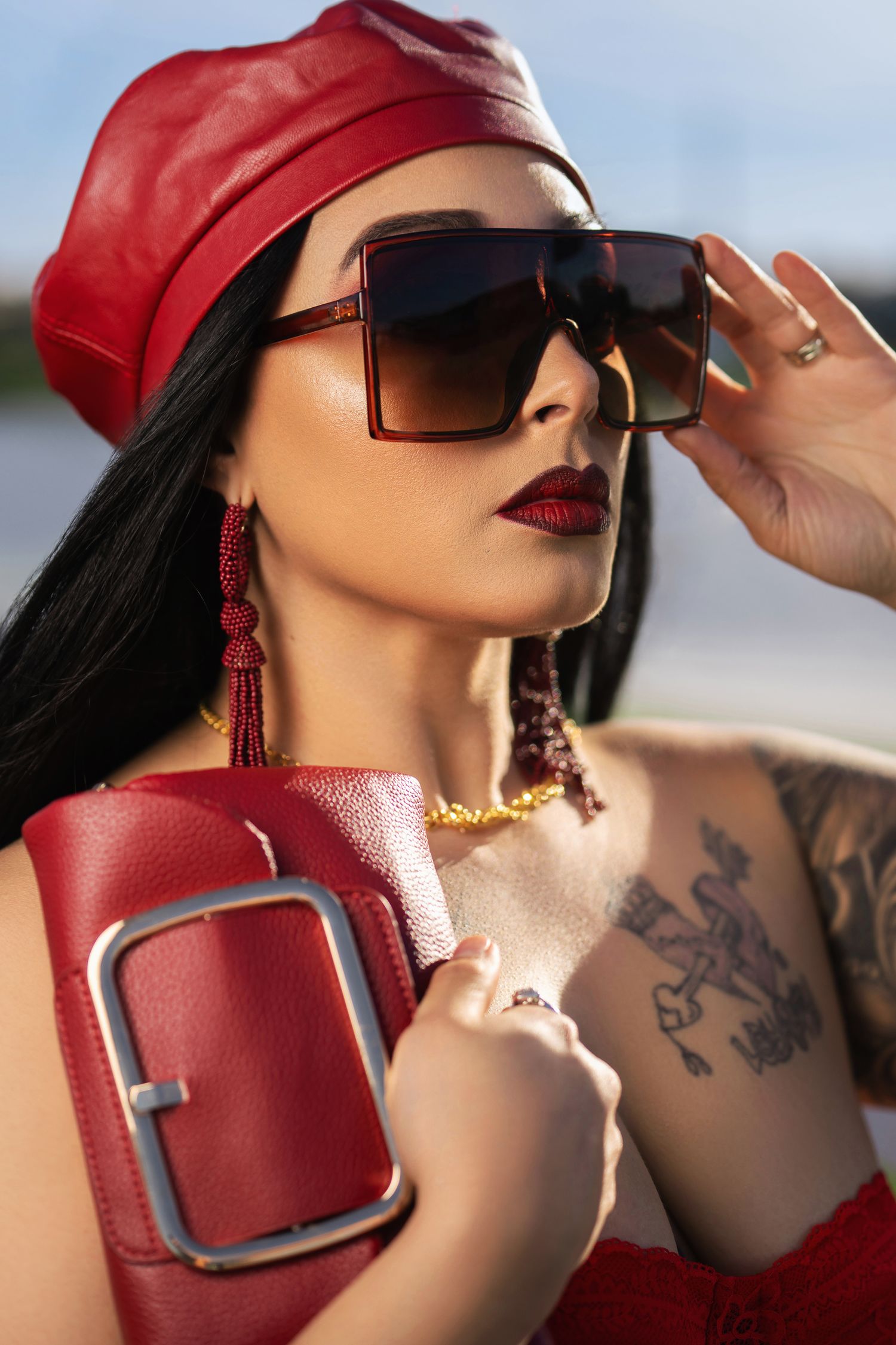 Orlando glamour photographer Ray Alvarez — bold fashion editorial portrait session with red styling and dramatic accessories