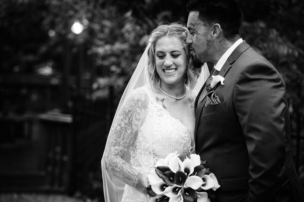 Classic black and white wedding portrait with calla lily bouquet.