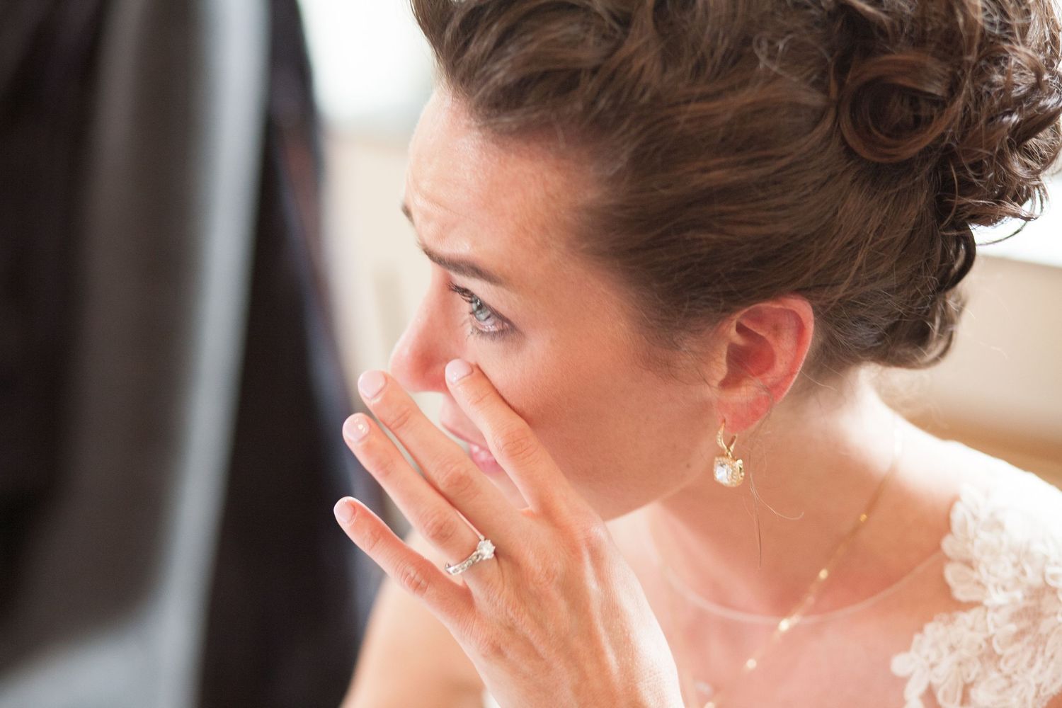 A close-up of an emotional moment during a wedding ceremony.