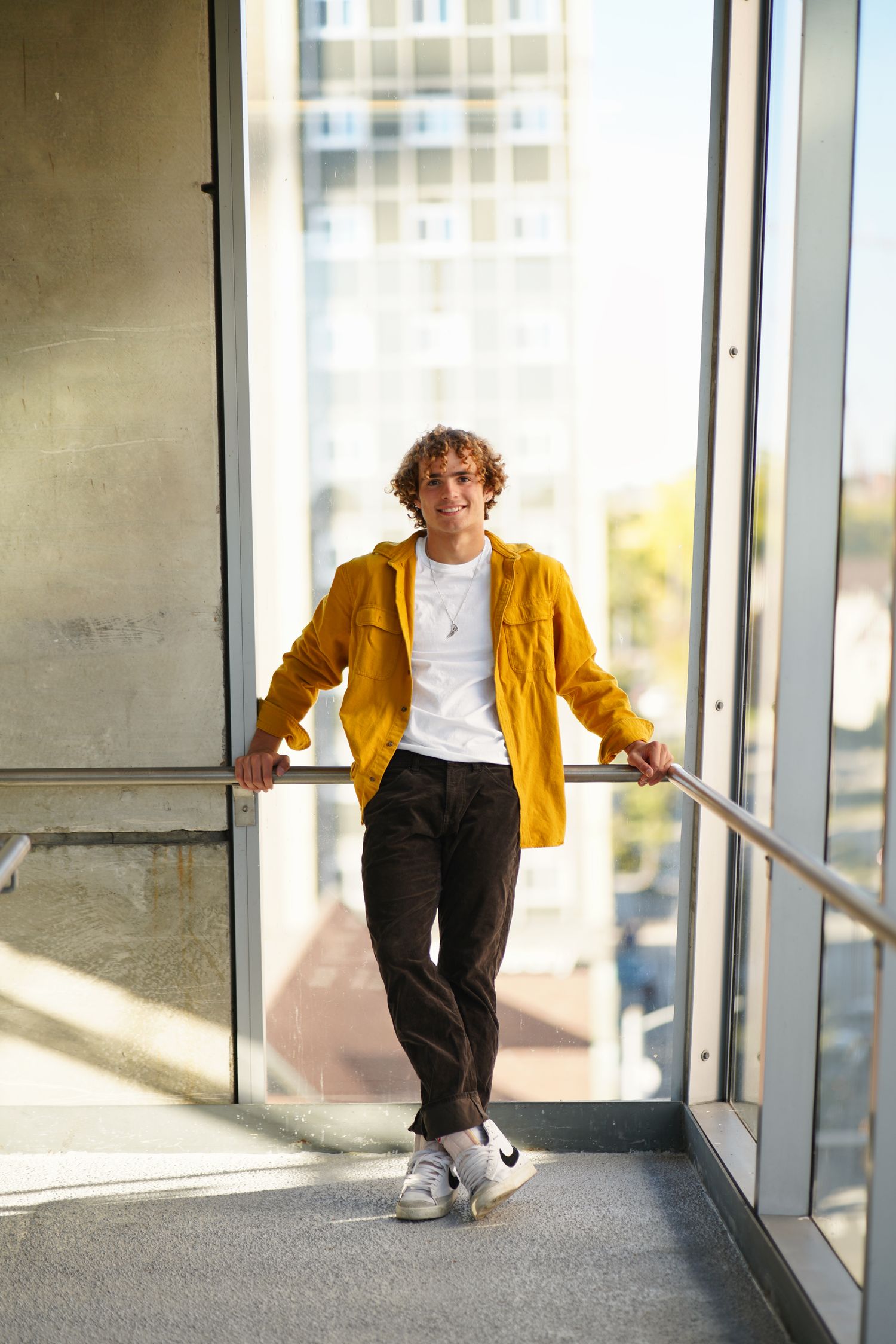 Senior portrait in Ann Arbor, Michigan with fall colors and soft natural light