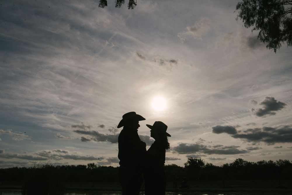backlights of a couple in front of the sky. McAllen photography