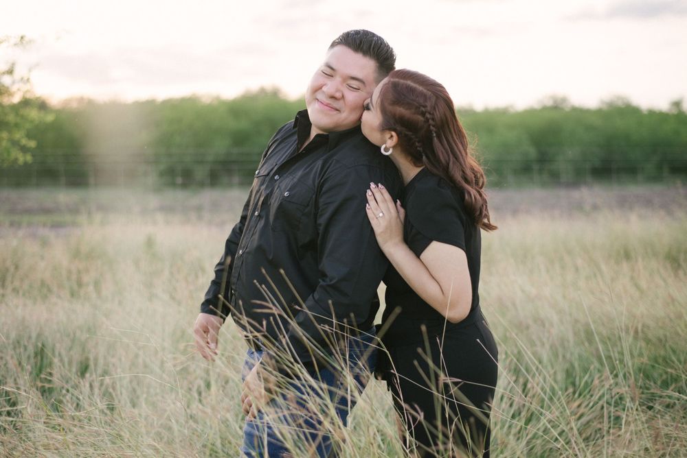 Girl whispering to boy. Engagement session. McAllen wedding photography