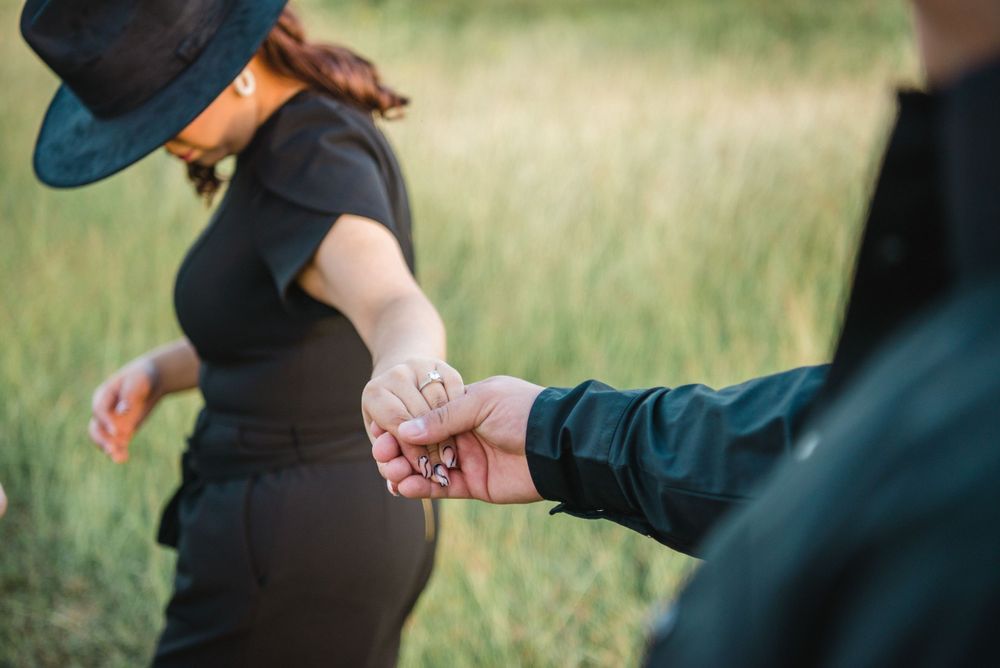 Couple holding hands and walking. McAllen wedding photography