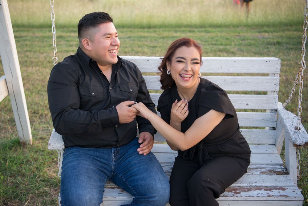 Couple sitting down and laughing at each other. Mission wedding photography