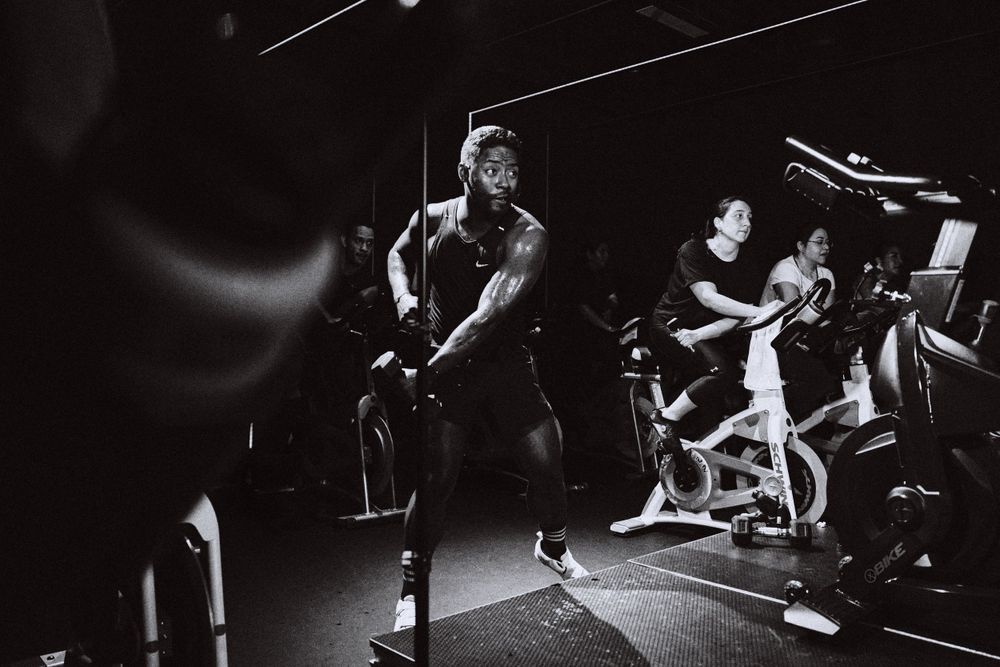 High energy performance captured in dramatic black and white lighting on stage.