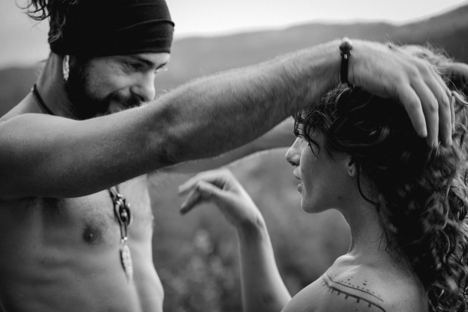 A tender intimate black and white moment between two people expressing affection and closeness.