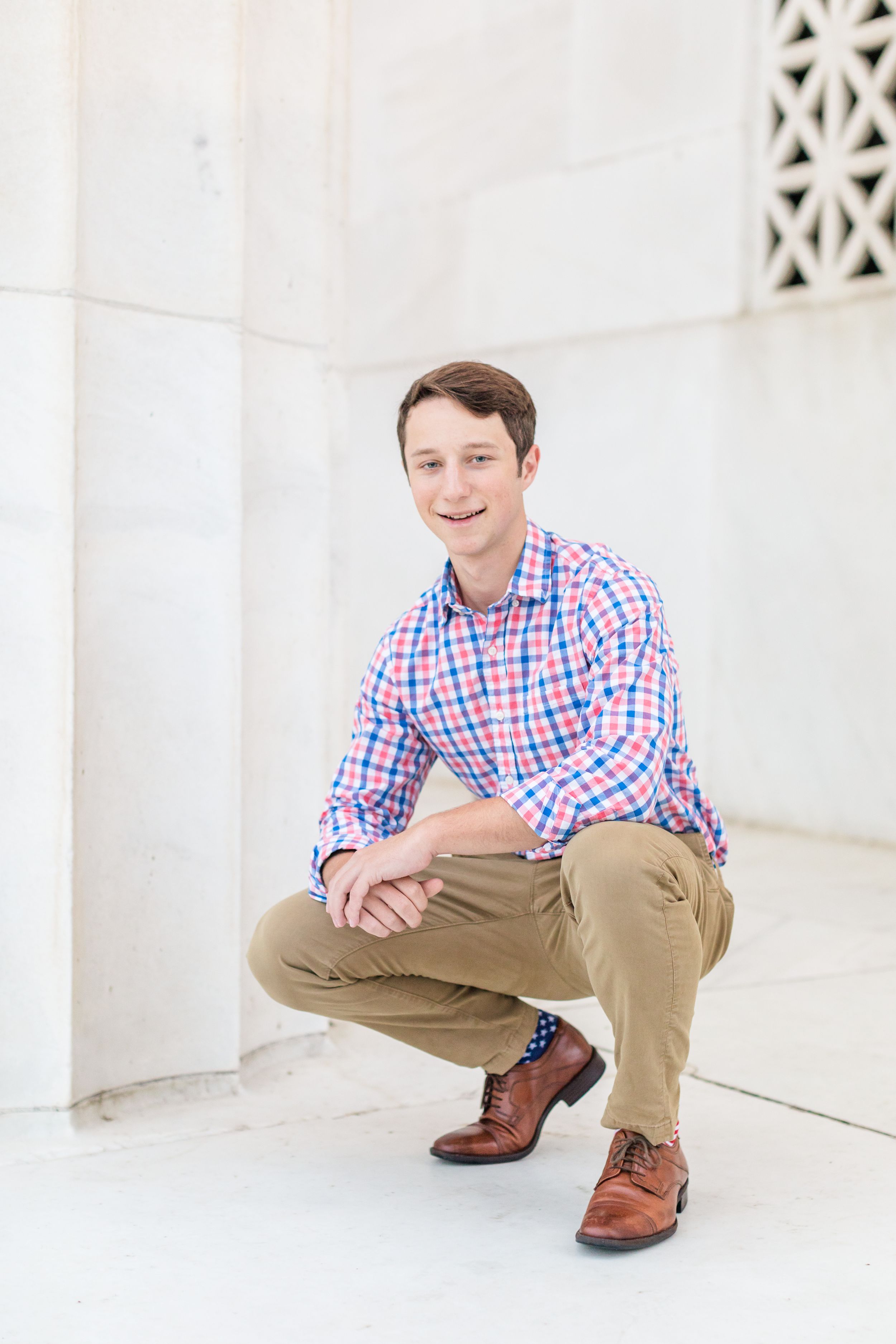 Senior boy posing at Lincoln Memorial columns