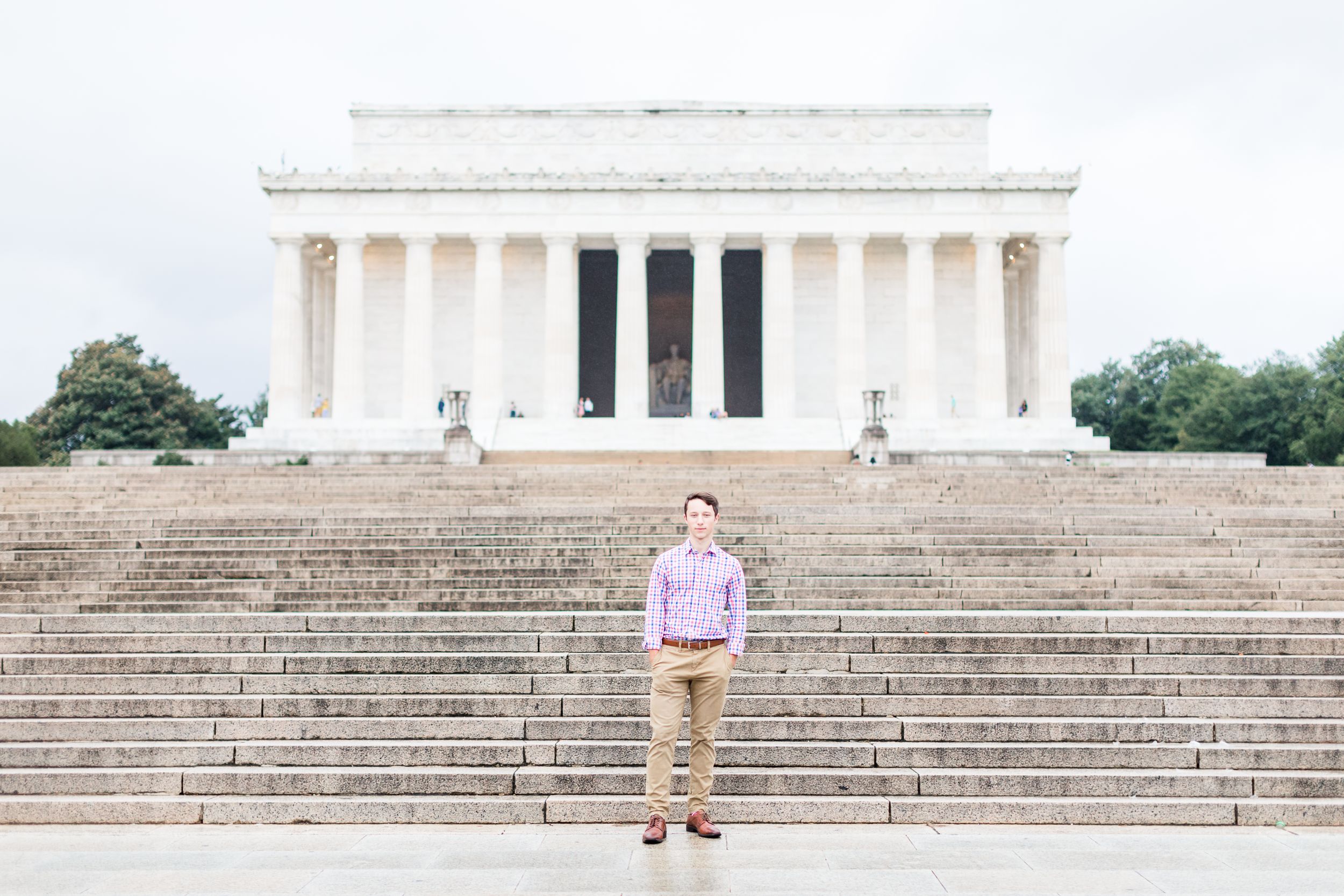 Senior boy posing with Lincoln Memorial in background
