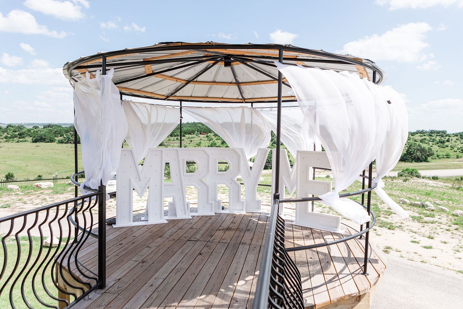 A romantic, surprise proposal at 290 Wine Castle in the Texas hill country.