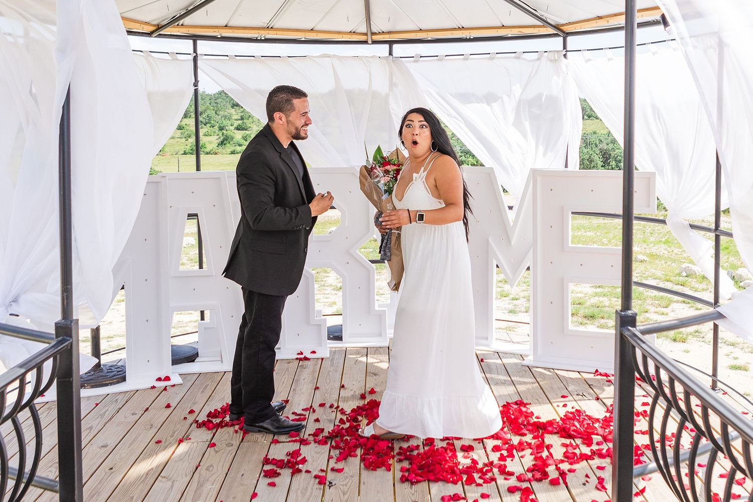 A romantic, surprise proposal at 290 Wine Castle in the Texas hill country.