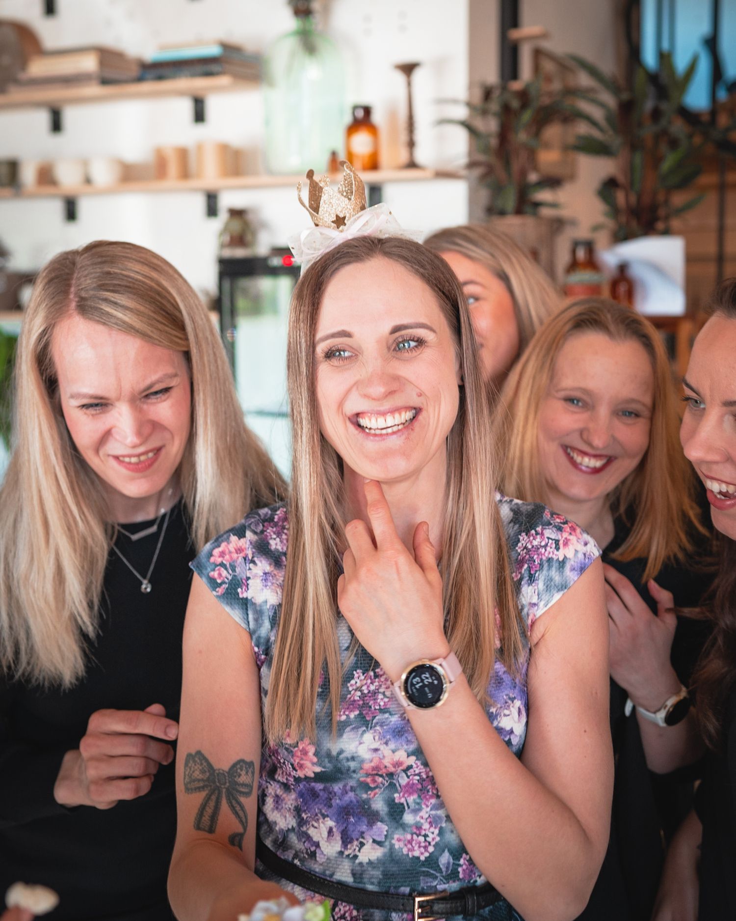 A joyful celebration moment with friends sharing laughter in a casual setting.