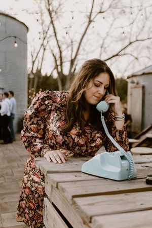 Women holding  Blue rotary phone audio voicemail wedding guestbook in Mobile, Alabama