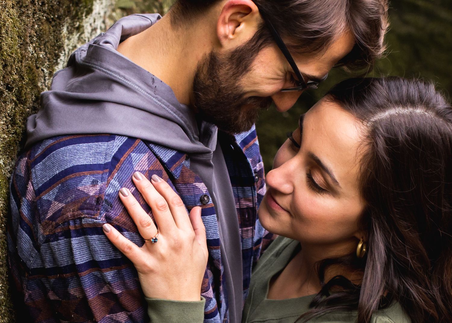 engagement photo of woman looking at ring