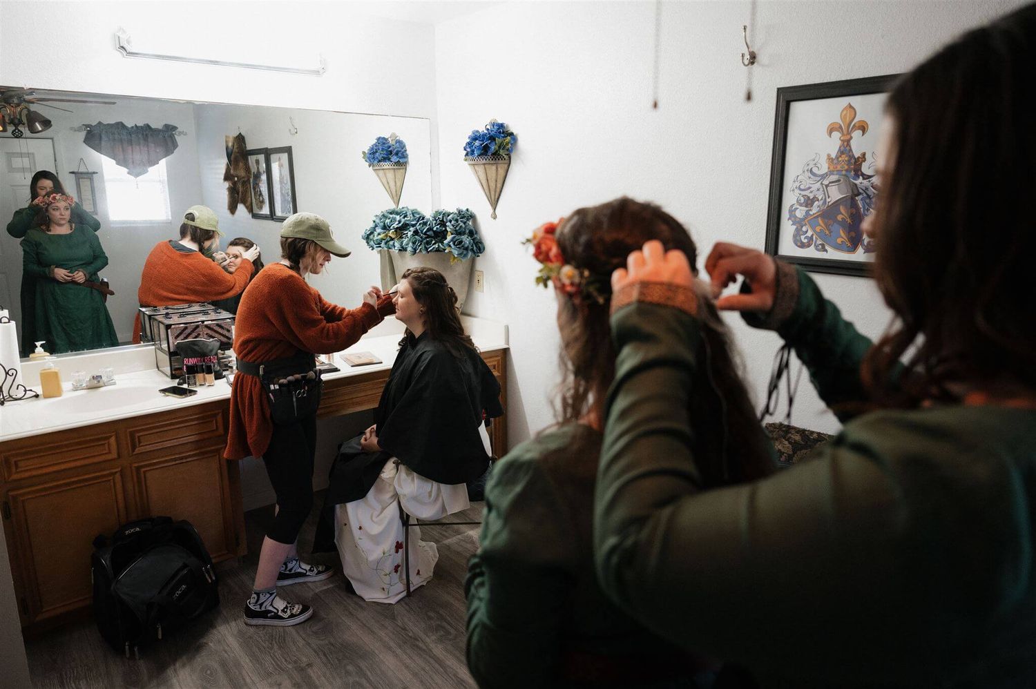 Behind the scenes preparation in a dressing room with mirrors and costumes.
