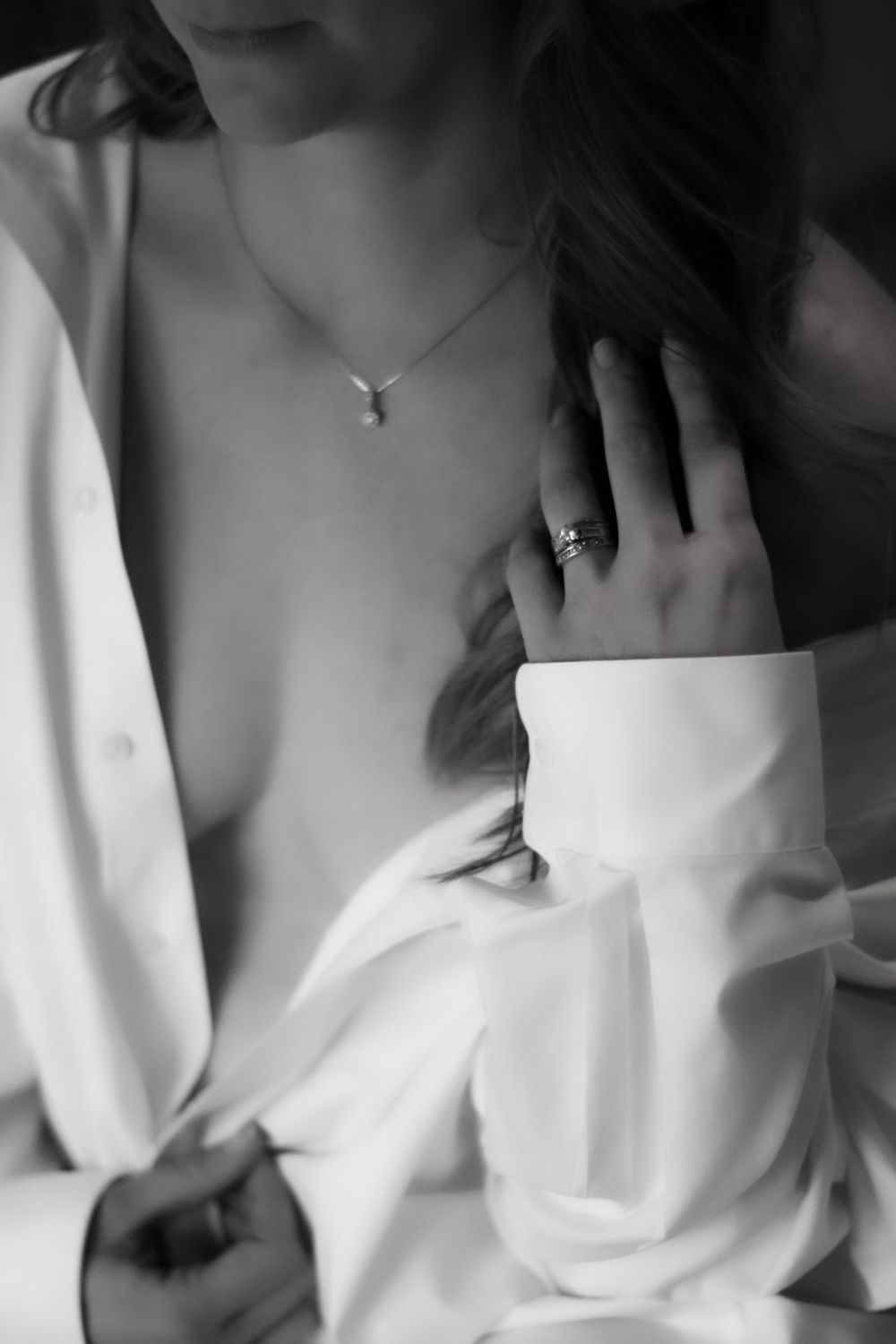 black and white boudoir model dressed in husbands shirt
