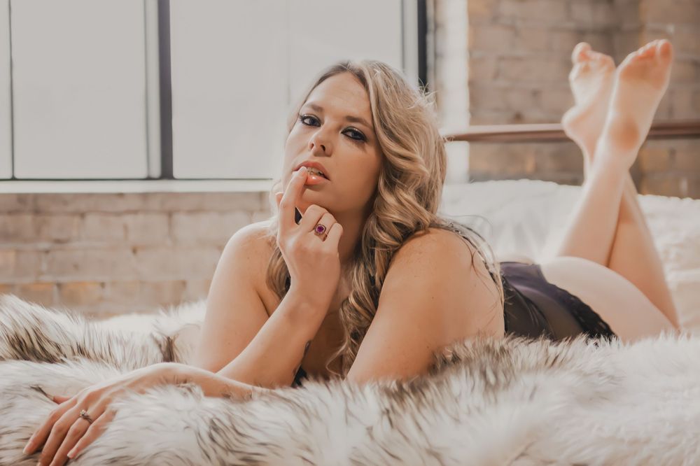 Plus size boudoir model posing