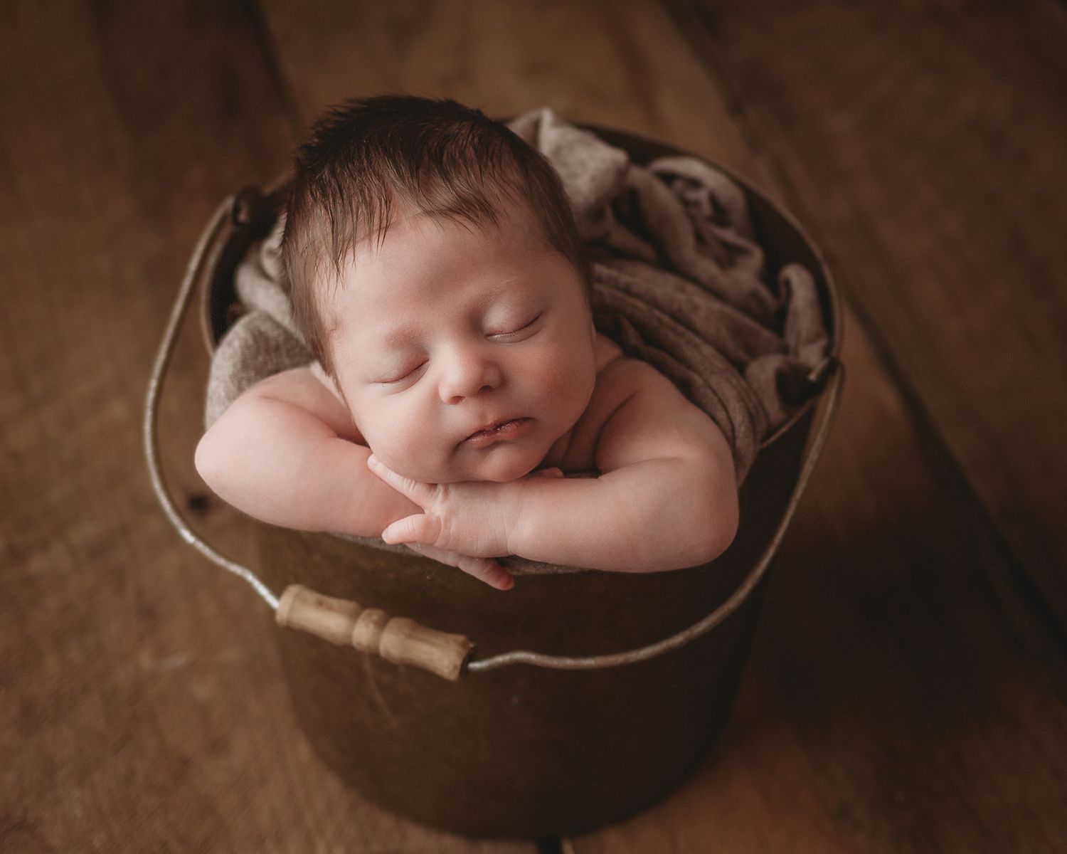 rustic bucket baby in newborn photography