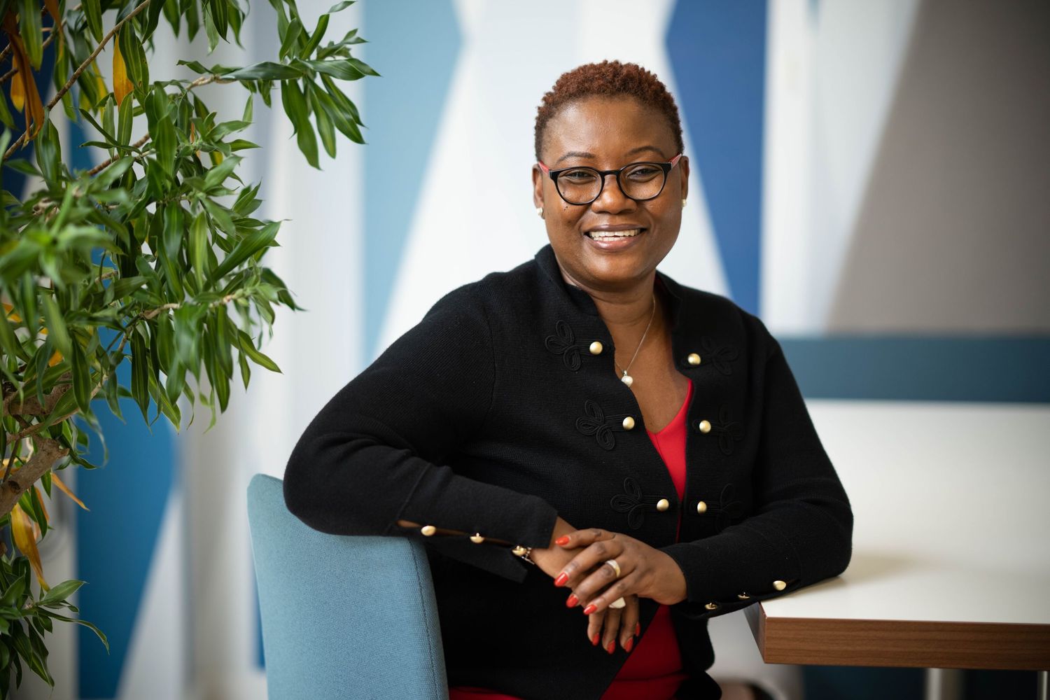 Relaxed corporate portrait of a lady in a meeting area, Portrait Headshot Photography