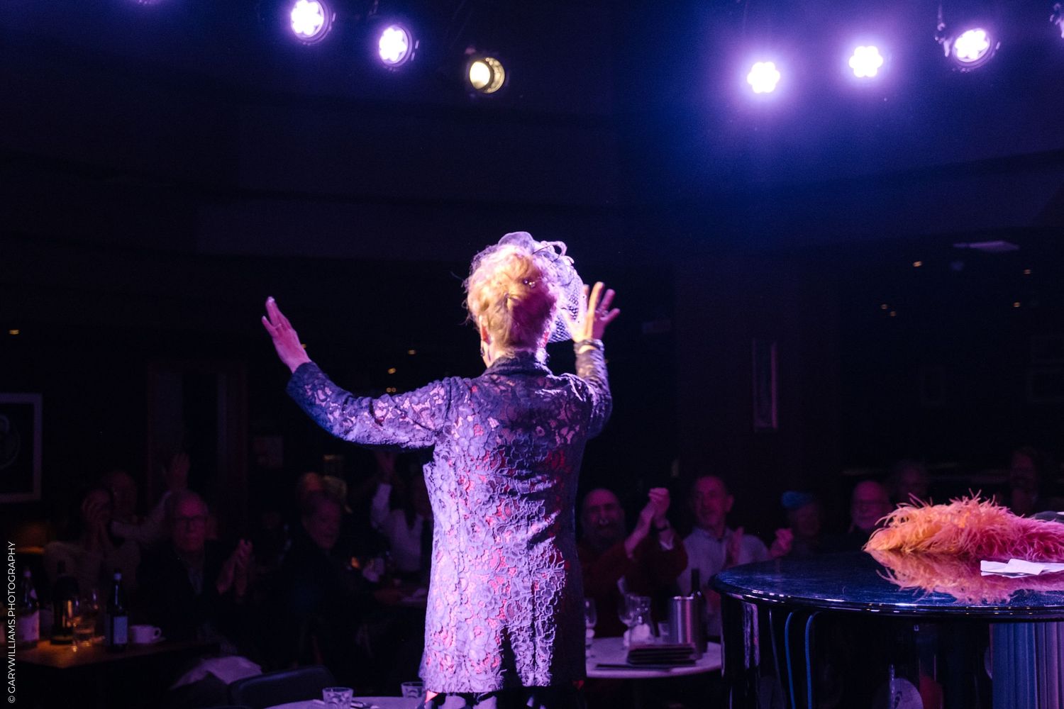 KT Sullivan takes a bow in front of an audience in London.